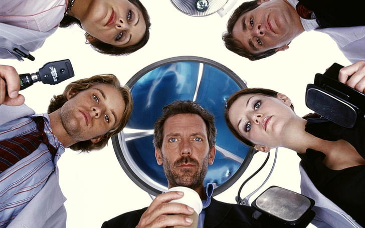 the cast of house md in a circle looking down